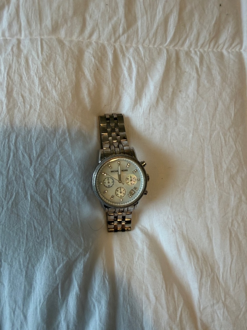 Michael Kors womens Silver-Tone Bracelet .A few scratches and needs battery .